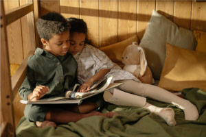 kids reading a book together