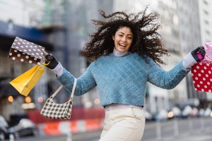 woman showing off her shopping purchases