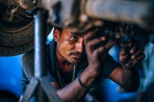 man working on car